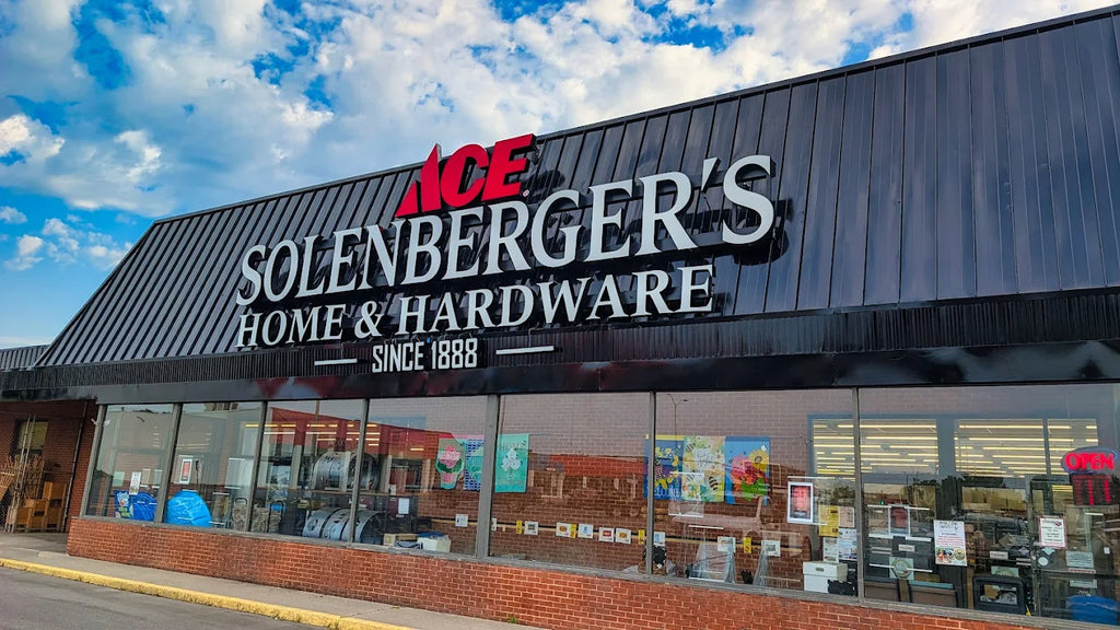 Solenberger's Home and Hardware storefront under a blue sky
