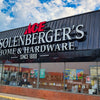 Solenberger's Home and Hardware storefront under a blue sky