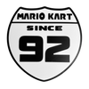 Mario Kart Since 1992 Wall Sign – Retro Gaming Shield Design – 8.53" x 8.54" – Adhesive Pad Included