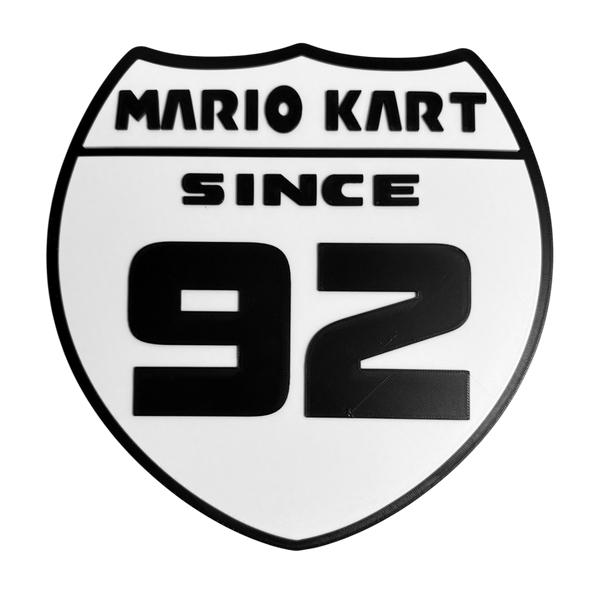 Mario Kart Since 1992 Wall Sign – Retro Gaming Shield Design – 8.53" x 8.54" – Adhesive Pad Included