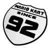 Mario Kart Since 1992 Wall Sign – Retro Gaming Shield Design – 8.53" x 8.54" – Adhesive Pad Included