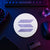 White and purple circular Solana crypto logo sign displayed flat on a neon-lit trader desk beside a keyboard, hardware wallet, and technical equipment.